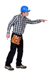 craftsman walking and pointing