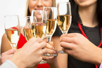  People hands with crystal glasses full of champagne