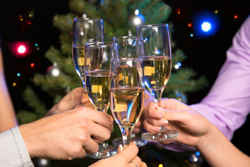People hands with crystal glasses full of champagne