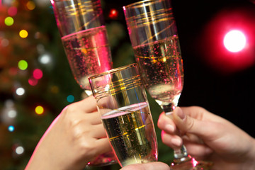 People hands with crystal glasses full of champagne