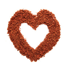 Frame with heart-shaped from grated dark chocolate.