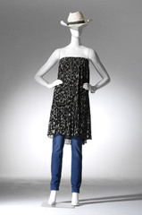 Full female in black clothes with hat on a mannequin