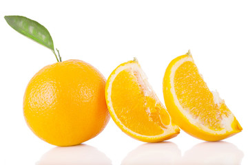 Oranges with leaves isolated on white