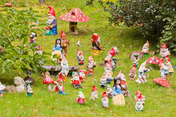 Collection of colorful dwarf figures in a garden. Fairytale. - obrazy, fototapety, plakaty