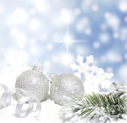 Christmas branch of tree ribbon bauble snow on blue background
