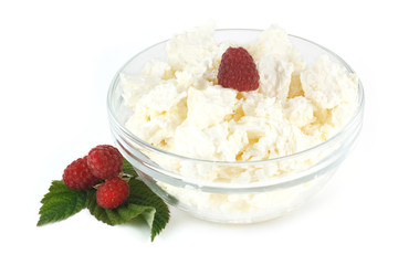 cottage cheese in a glass bowl and raspberries