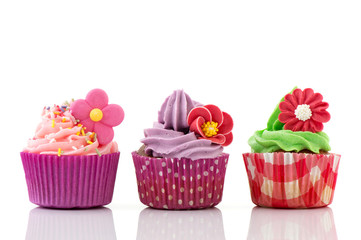 Colorful cupcakes with flowers