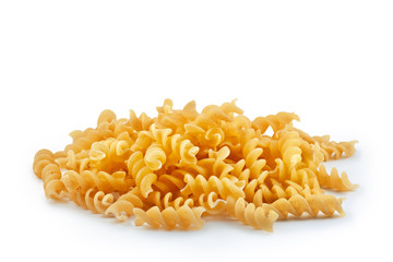 Pile of golden fusilli pasta isolated on white