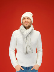 handsome man in warm sweater, hat and scarf