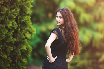Portrait of young woman standing on the street
