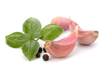 Garlic clove and basil leaf