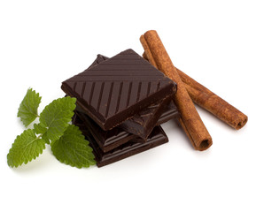 Chocolate bars stack and cinnamon sticks