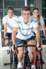 People On Exercise Bikes