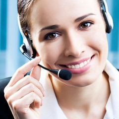 Happy smiling support phone operator at office