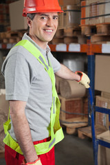 Foreman Holding Handtruck At Warehouse