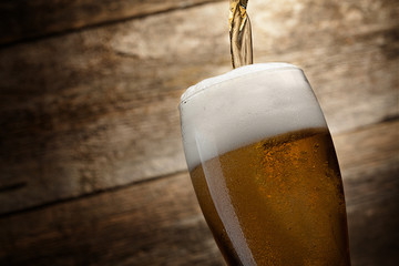glass beer on wood background with copyspace