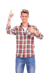 young casual man pointing