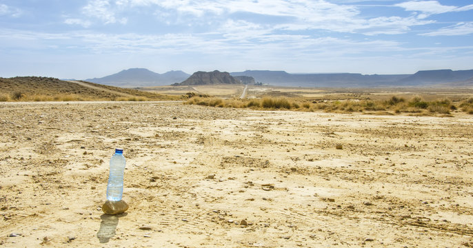 Bottle of water in Desert of the Bardenas Reales in Navarre