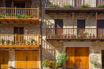 Building facade with lot of flower pots