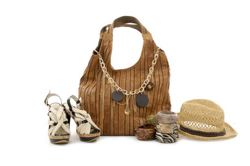background of pair female footwear, a necklace, a bag.