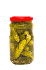 glass jar canned cucumbers on white