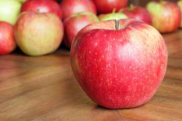 Red Apples on a Brown Table