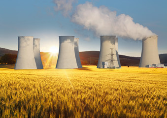 Nuclear power plant with yellow field and sun