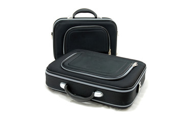 Two black suitcases - vacation baggage - isolated