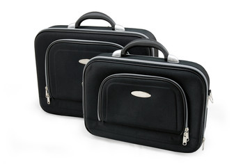 Two black suitcases - vacation baggage - isolated