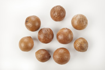 nuts of macadamia on white background