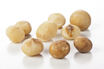 nuts of macadamia on white background