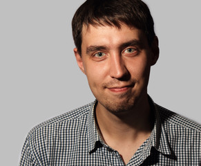 Fototapeta premium Funny smiling young man