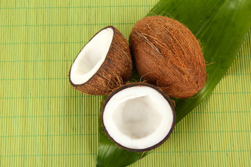 coconuts on a green wicker mst close-up