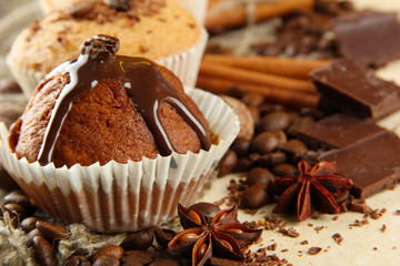 tasty muffin cakes with chocolate, spices and coffee seeds,