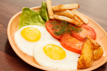 fried eggs with vegetables