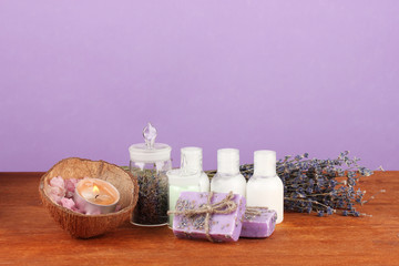 ingredients for soap making on violet background