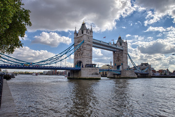 Side view of Tower Bridge with river Thames, London