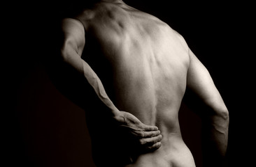 Fototapeta na wymiar Muscular Man with Backache