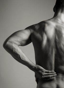 Muscular Man with Backache