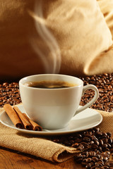 Composition with white cup of coffee