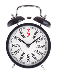 Alarm clock with the word Now