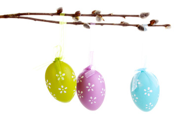 Colorful easter eggs hanging on ribbons isolated on white