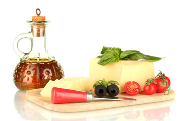 sliced mozzarella cheese with vegetables isolated on white