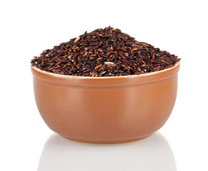 black rice in a brown  plate , isolated on white