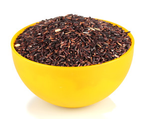 black  rice in a  yellow plate , isolated on white