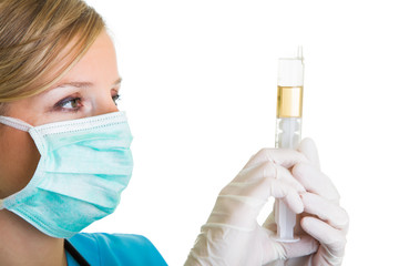Woman in doctor uniform wearing latex gloves