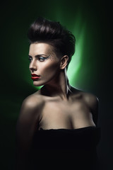 Fototapeta na wymiar sexy woman with red lips in green light