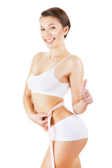 Obraz premium woman measuring her waist