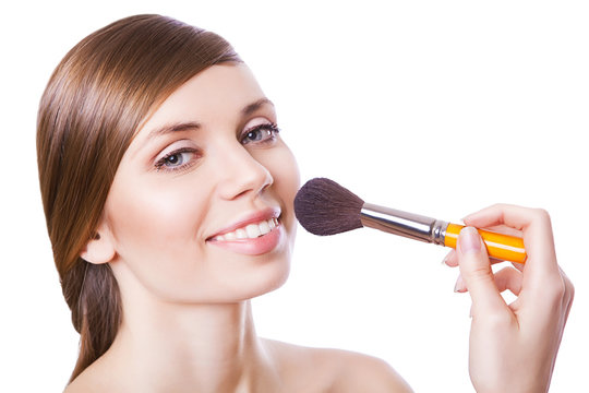 sexy woman with cosmetic brush
