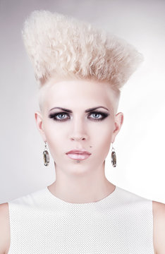 close up portrait of futuristic blond woman with creative hairst